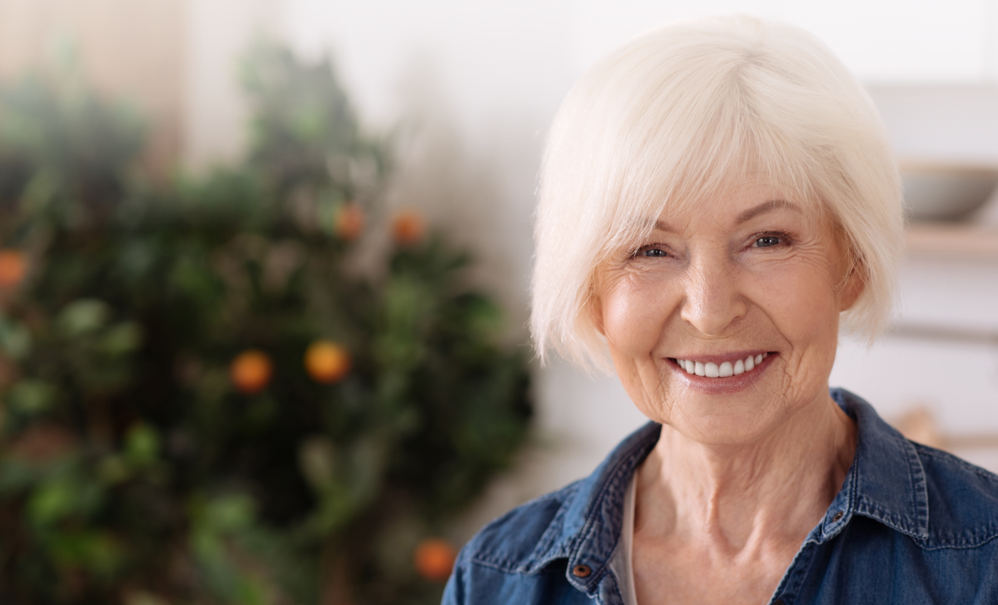 Older woman with denture smiling