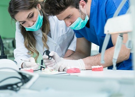 Dental lab technicians crafting dentures