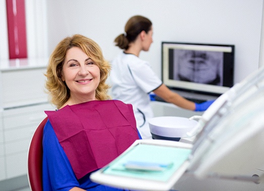 An older woman at her dental appointment.