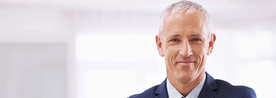 Man smiling before denture tooth replacement