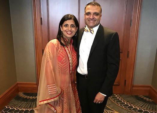 Doctor Patel and his wife dressed for a black tie event