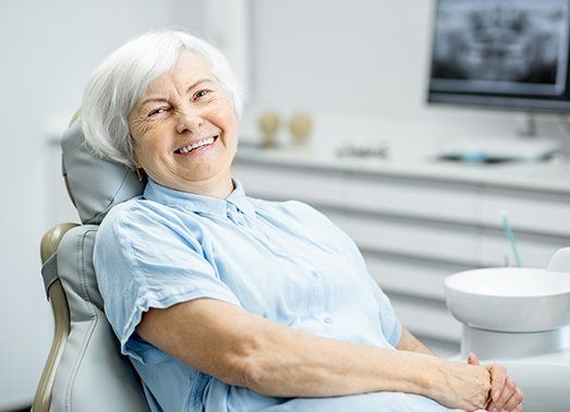 Older woman in dental chair for denture patient exam