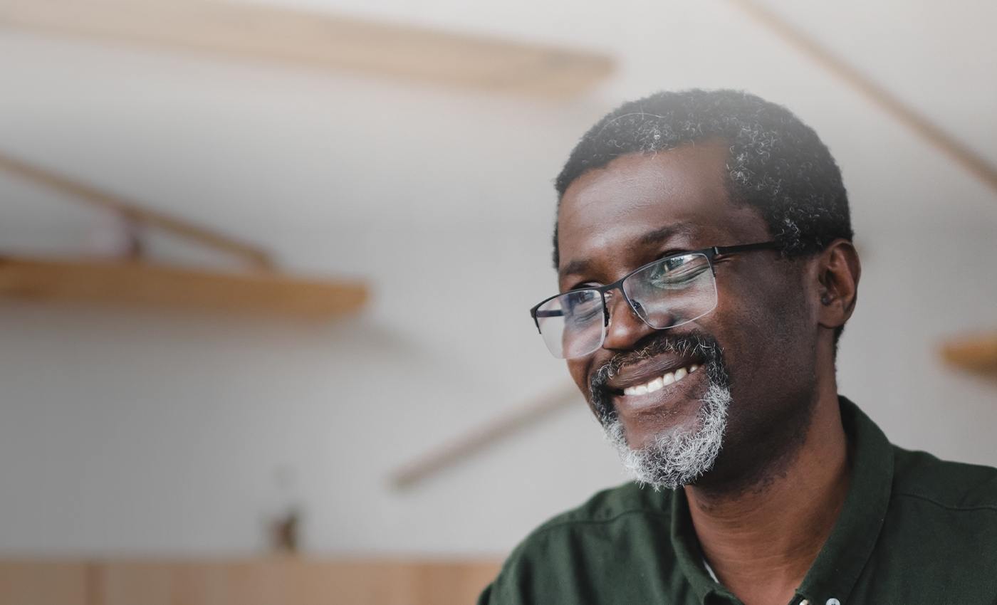 Man smiling after receiving denture