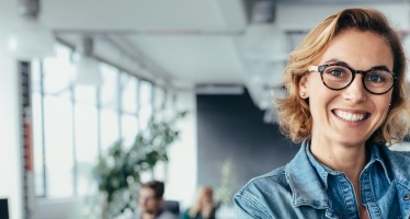 Woman smiling after tooth extraction