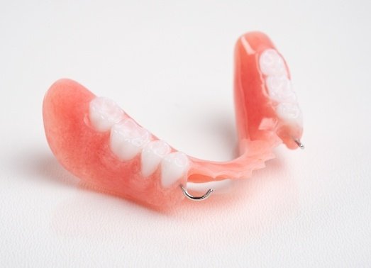 Partial denture with metal clasps
